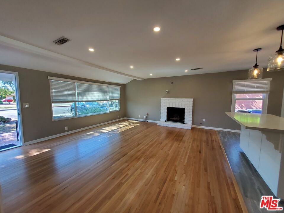 Empty room, Fireplace, Interior, Pendant Lights, Recessed Lighting, Wood Texture Flooring