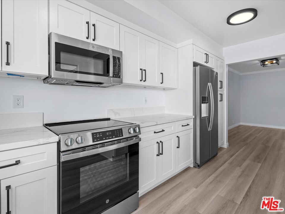 Interior, Kitchen, Recessed Lighting, Stainless Steel Appliances, Wood Texture Flooring