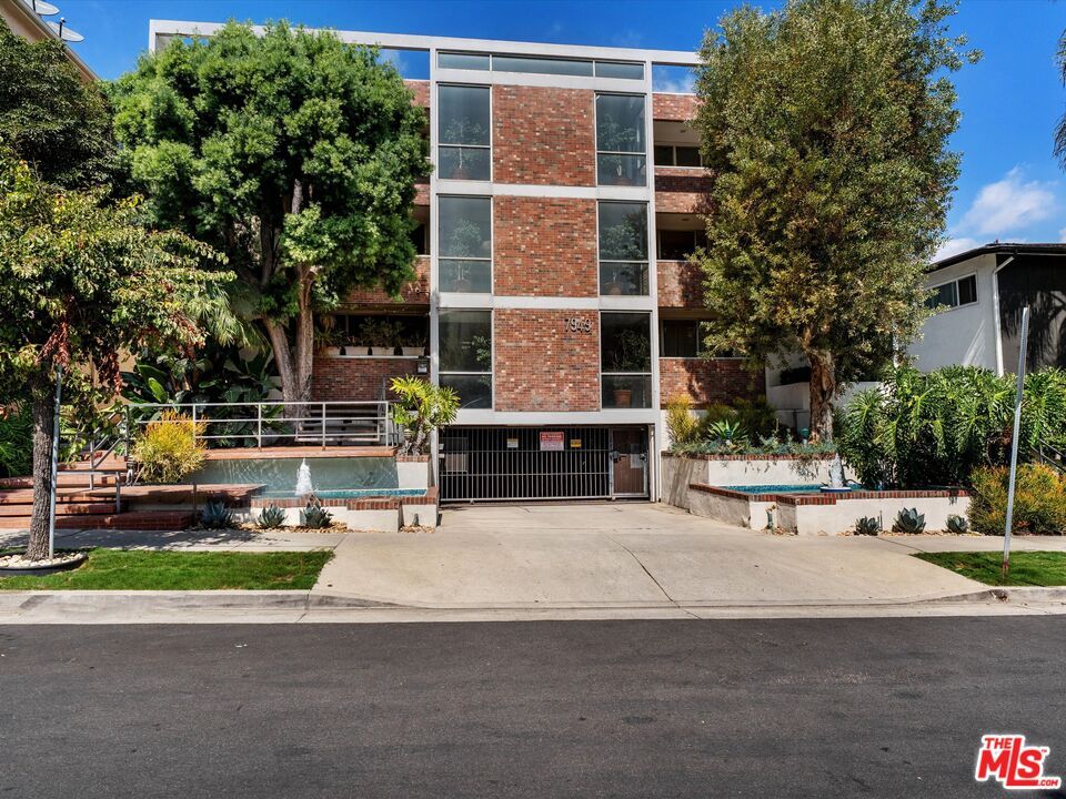 Exterior, Facade, Brick Facade, Pool, Condo Building