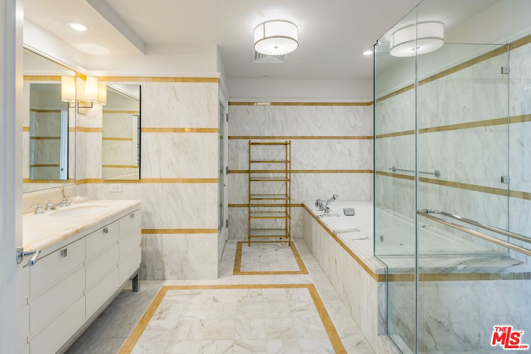 Bathroom, Dual Sink Vanities, Glass Shower, Interior, Marble, Marble Walls, Recessed Lighting