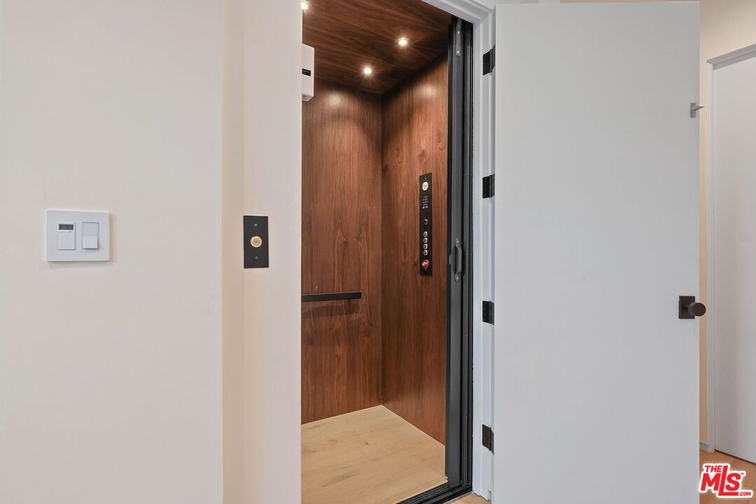 Elevator, Interior, Recessed Lighting, Wooden Ceilings, Wood Texture Flooring, Wooden Walls