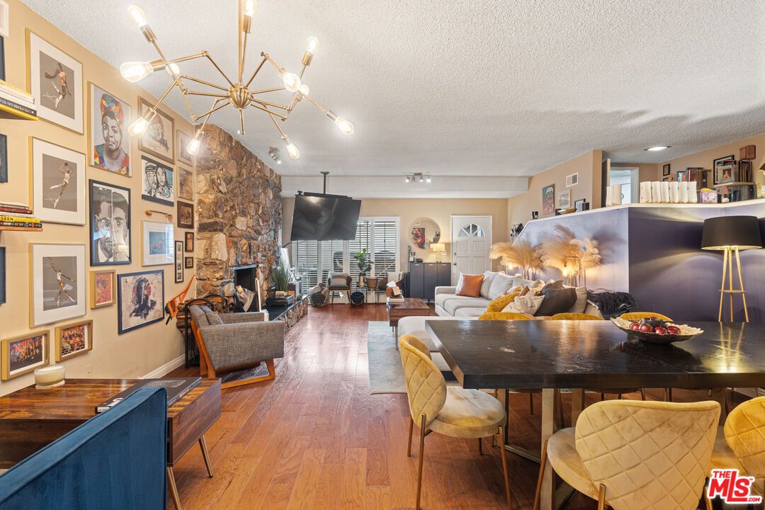 Dining room, Fireplace, Interior, Living room, Pendant Lights, Stone Walls, Wood Texture Flooring