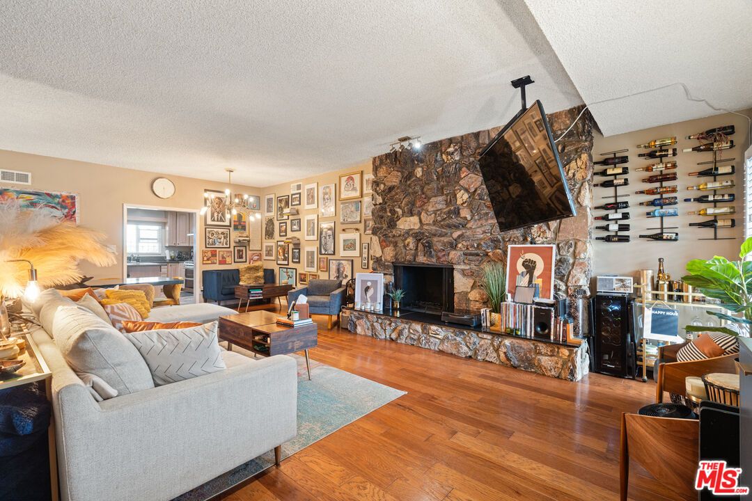 Dining room, Fireplace, Interior, Living room, Pendant Lights, Stone Walls, Wood Texture Flooring