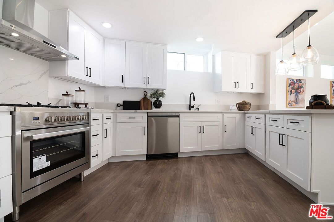 Interior, Kitchen, Marble Walls, Pendant Lights, Recessed Lighting, Stainless Steel Appliances, Wood Texture Flooring