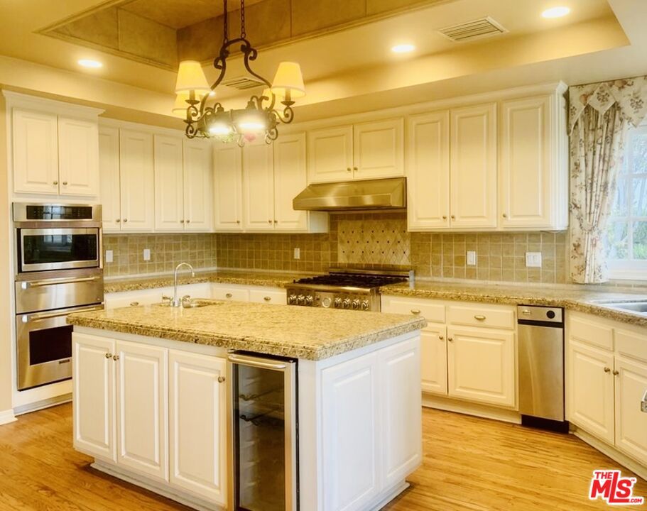 Chandelier, Interior, Kitchen, Pendant Lights, Recessed Lighting, Stainless Steel Appliances, Wood Texture Flooring