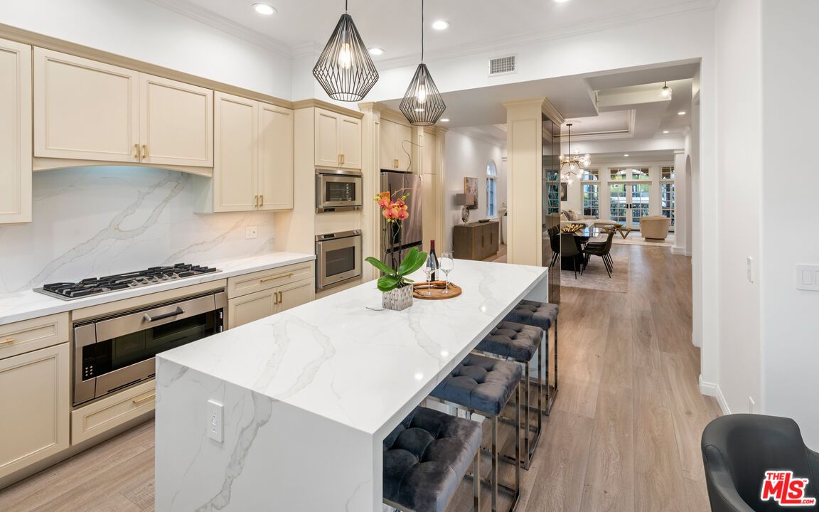 Dining room, Interior, Kitchen, Pendant Lights, Recessed Lighting, Stainless Steel Appliances, Wood Texture Flooring