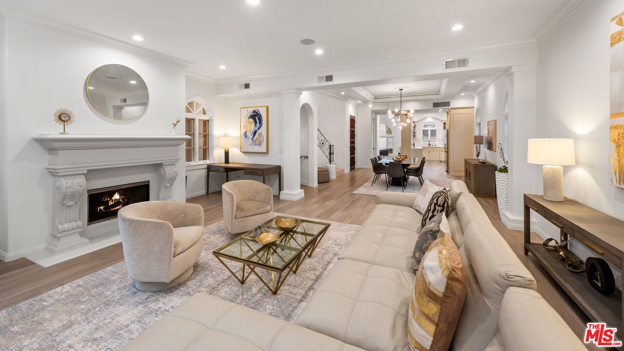 Chandelier, Dining room, Fireplace, Interior, Living room, Pendant Lights, Recessed Lighting, Wood Texture Flooring