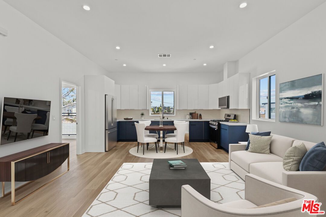 Dining room, Interior, Kitchen, Living room, Recessed Lighting, Stainless Steel Appliances, Wood Texture Flooring