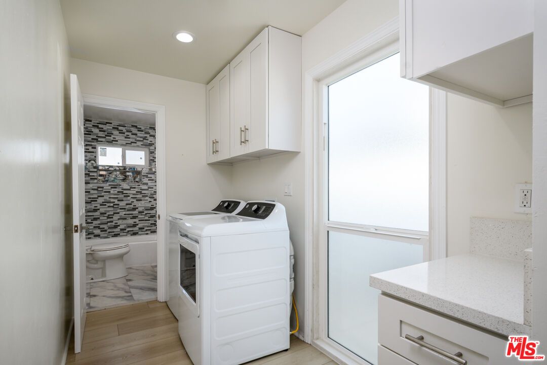 Bathroom, Interior, Marble, Recessed Lighting, Washer, Wood Texture Flooring