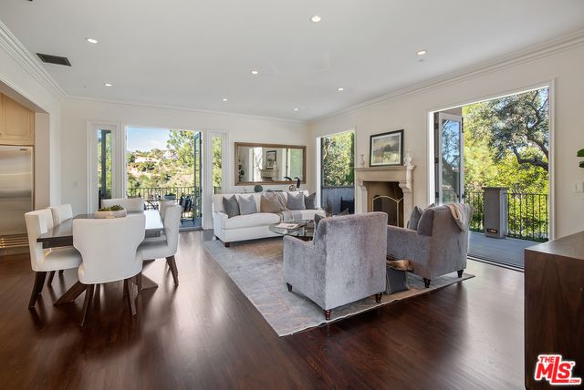 Dining room, Fireplace, Interior, Living room, Recessed Lighting, Wood Texture Flooring