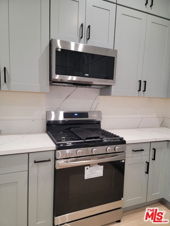 Interior, Kitchen, Marble Walls, Stainless Steel Appliances, Wood Texture Flooring