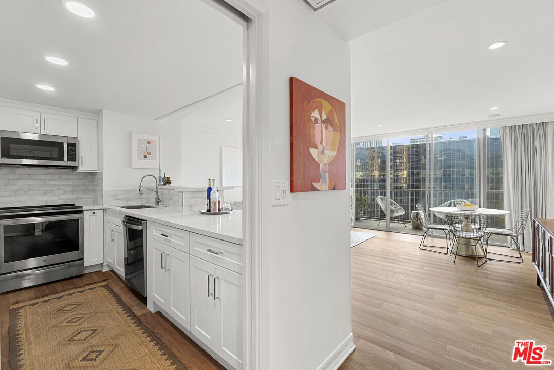 Dining room, Interior, Kitchen, Recessed Lighting, Stainless Steel Appliances, Wood Texture Flooring