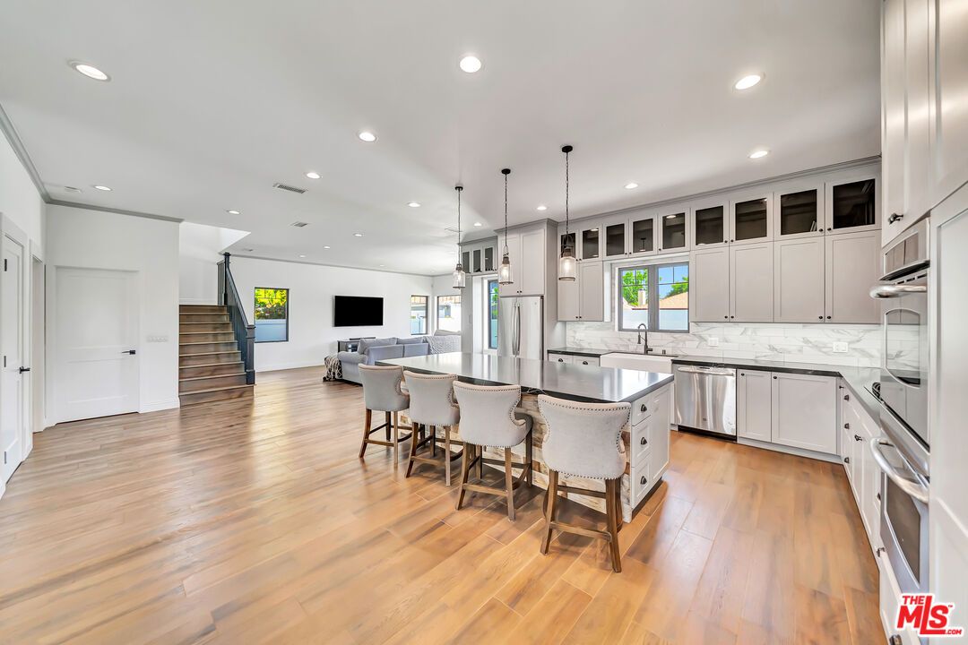 Interior, Kitchen, Marble Walls, Pendant Lights, Recessed Lighting, Stainless Steel Appliances, Wood Texture Flooring