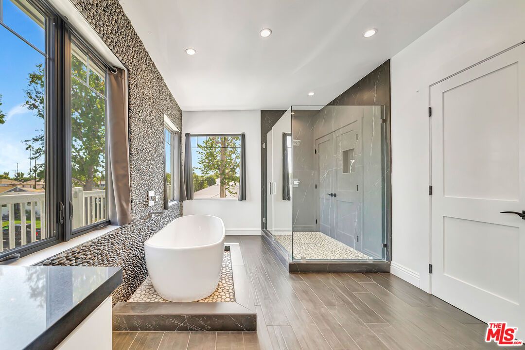 Bathroom, Free Standing Baths, Glass Shower, Interior, Recessed Lighting, Wood Texture Flooring