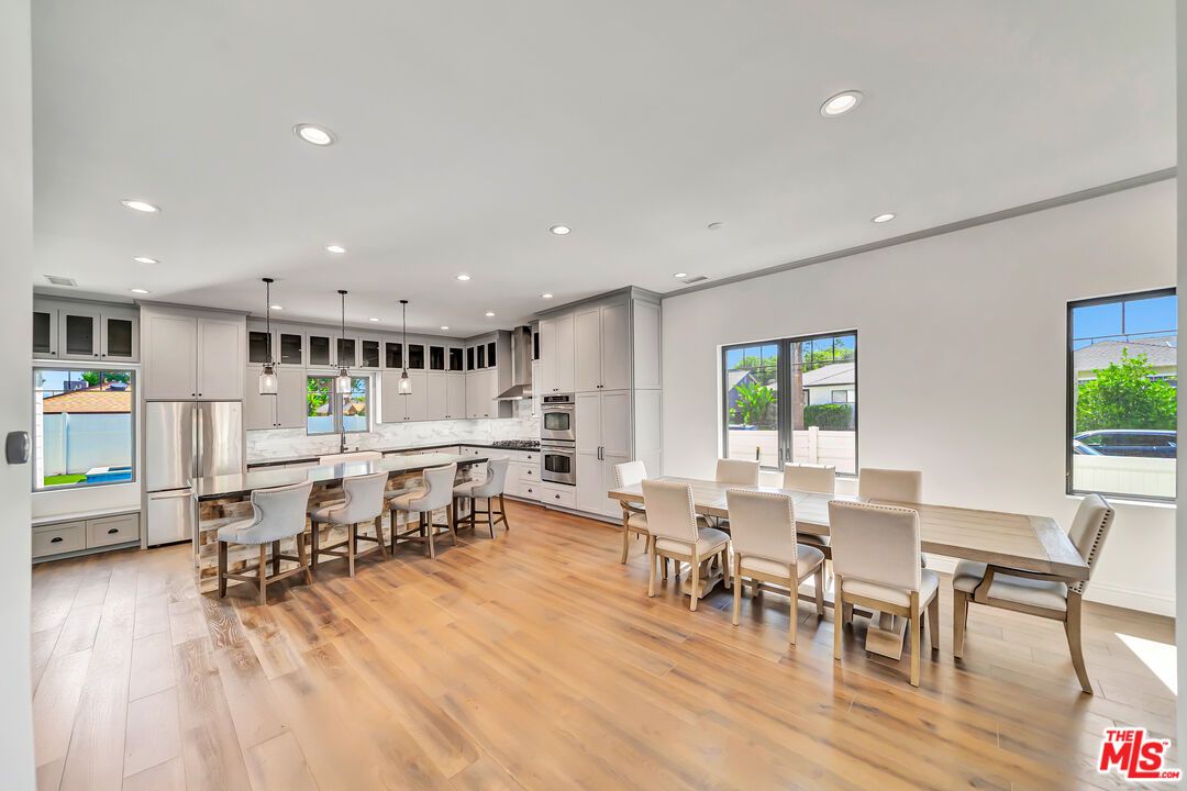 Dining room, Interior, Kitchen, Pendant Lights, Recessed Lighting, Stainless Steel Appliances, Wood Texture Flooring