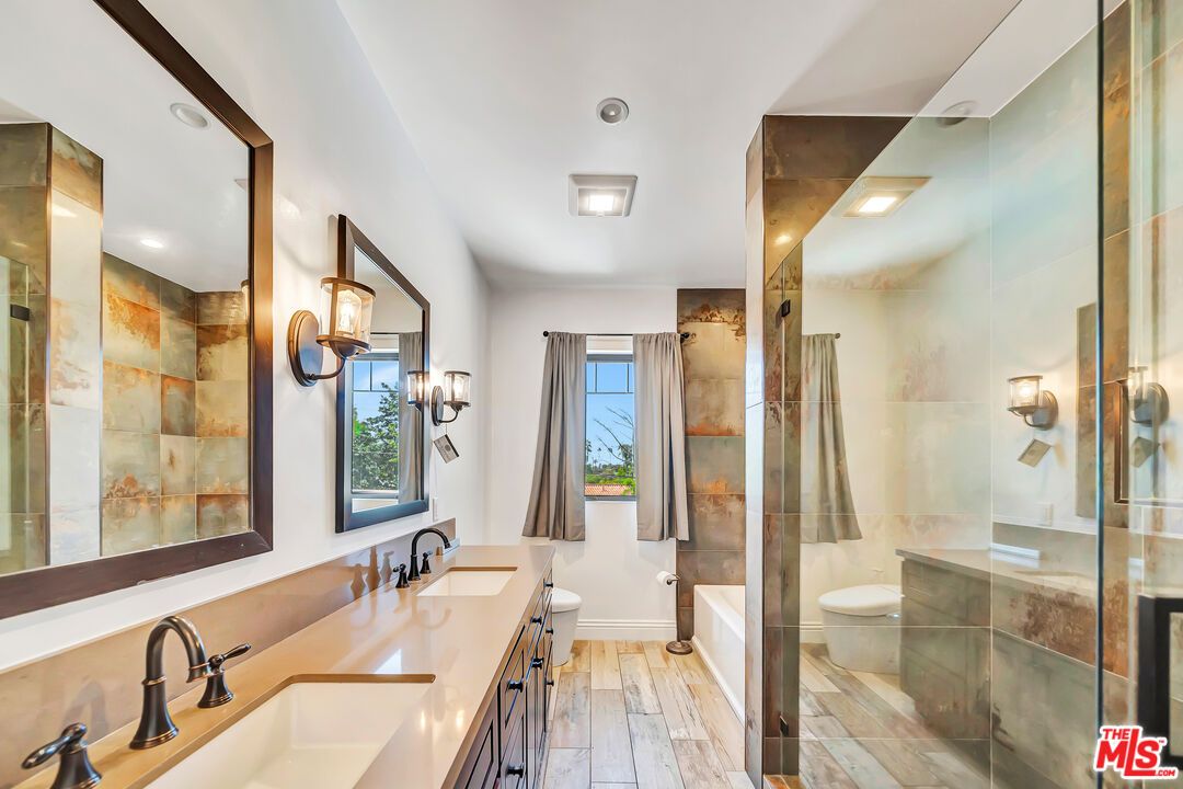 Bathroom, Dual Sink Vanities, Glass Shower, Interior, Recessed Lighting, Wood Texture Flooring