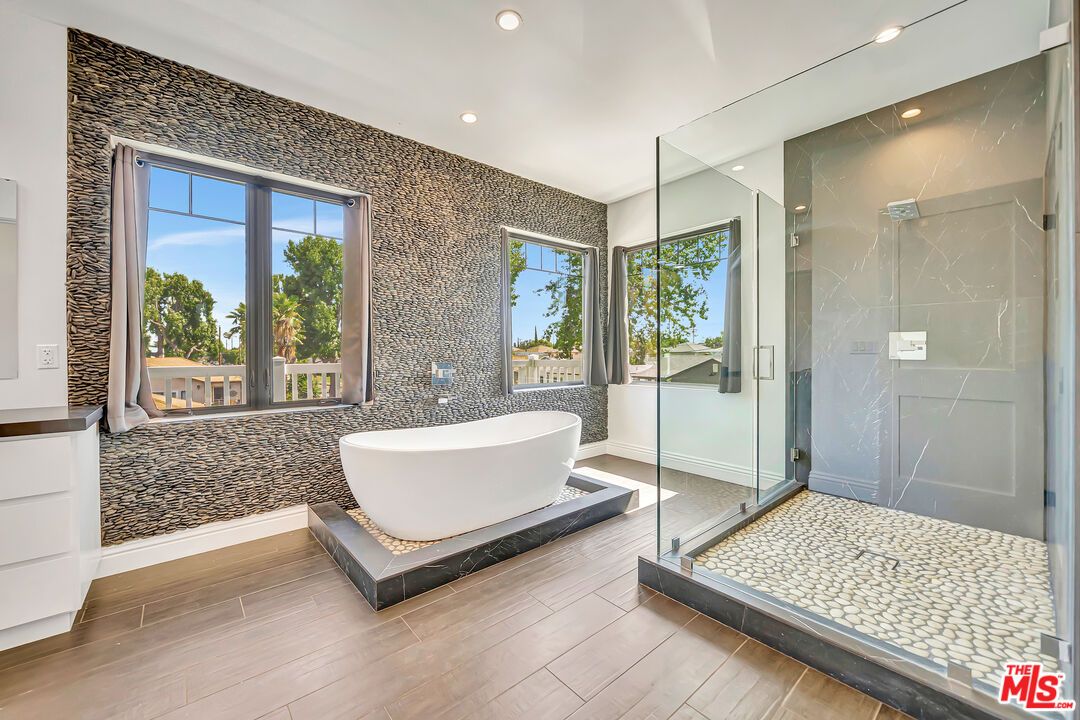 Bathroom, Free Standing Baths, Glass Shower, Interior, Marble Walls, Recessed Lighting, Wood Texture Flooring