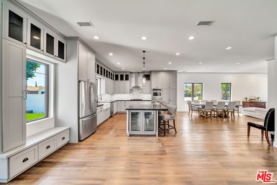 Dining room, Interior, Kitchen, Pendant Lights, Recessed Lighting, Stainless Steel Appliances, Wood Texture Flooring