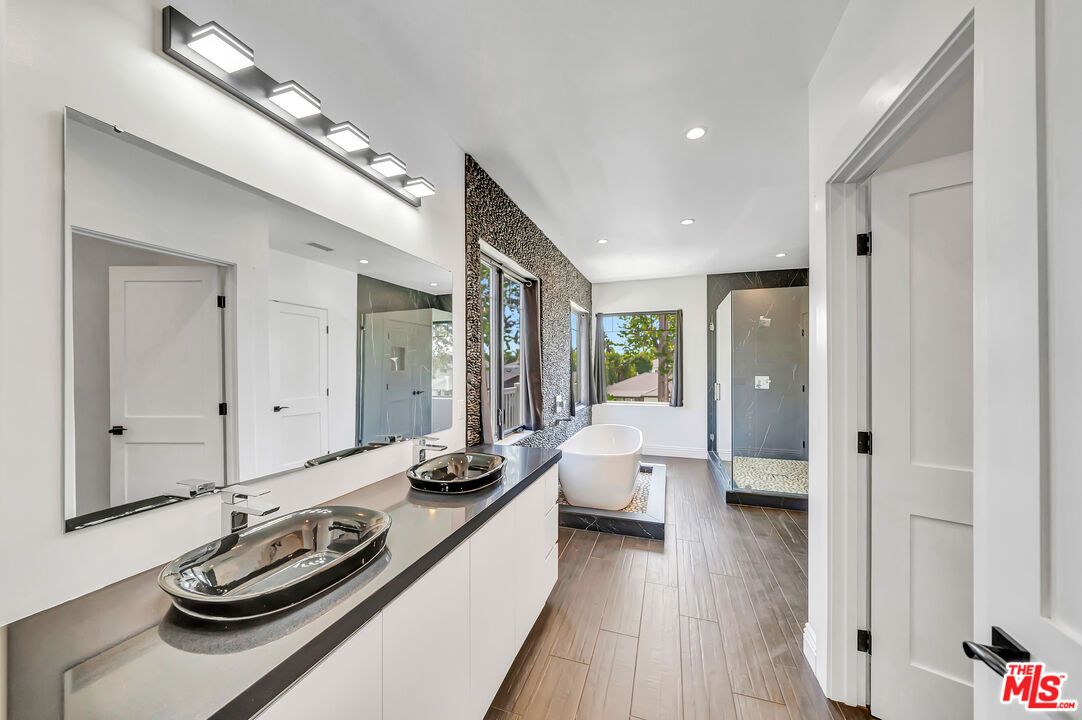 Bathroom, Dual Sink Vanities, Free Standing Baths, Interior, Recessed Lighting, Wood Texture Flooring