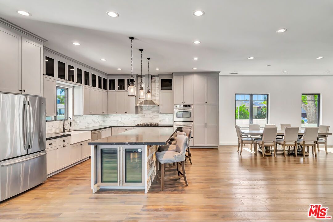 Dining room, Interior, Kitchen, Pendant Lights, Recessed Lighting, Stainless Steel Appliances, Wood Texture Flooring