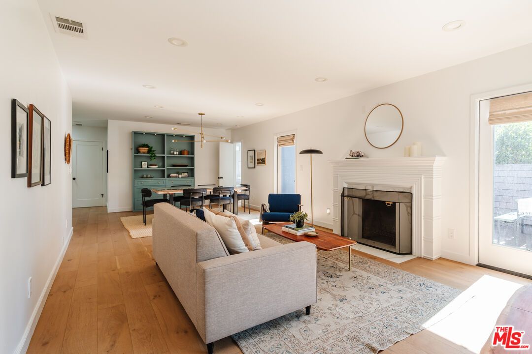 Dining room, Fireplace, Interior, Living room, Pendant Lights, Recessed Lighting, Wood Texture Flooring