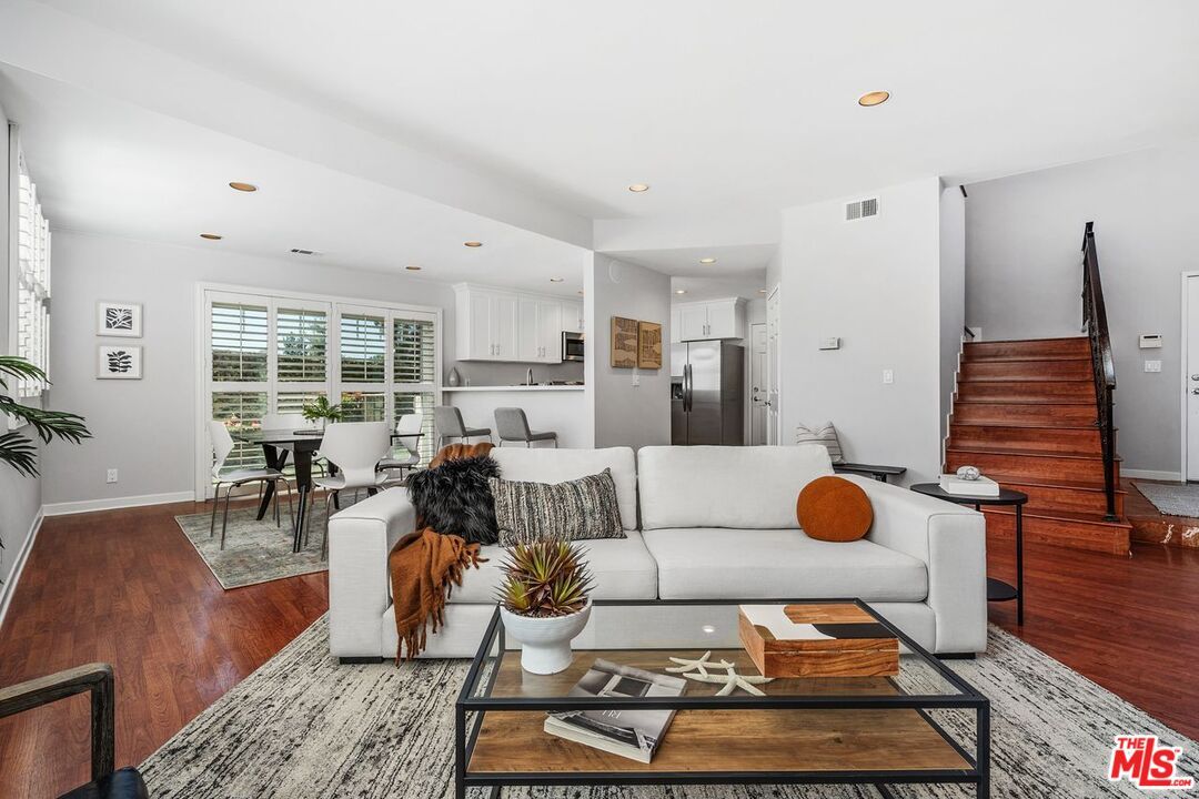 Dining room, Interior, Kitchen, Living room, Recessed Lighting, Stainless Steel Appliances, Wood Texture Flooring