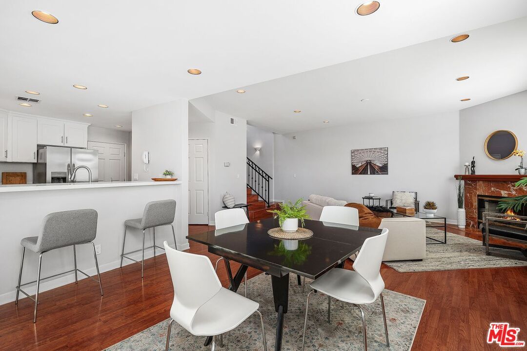 Dining room, Fireplace, Interior, Kitchen, Living room, Recessed Lighting, Wood Texture Flooring