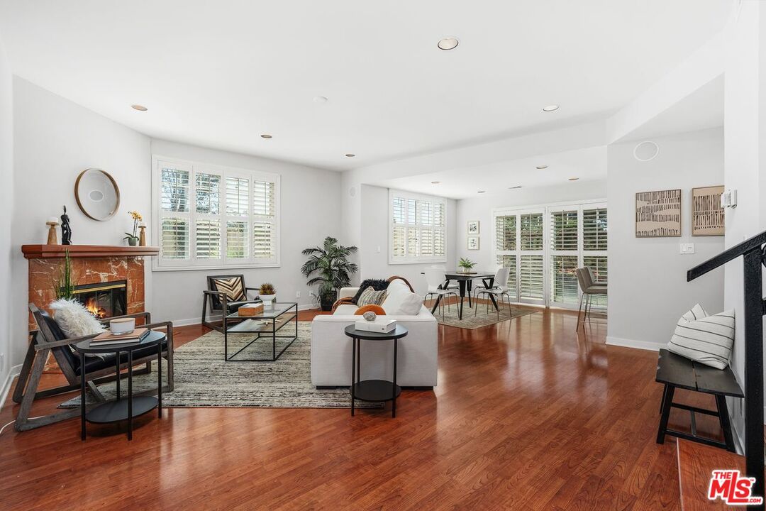 Dining room, Fireplace, Interior, Living room, Recessed Lighting, Wood Texture Flooring
