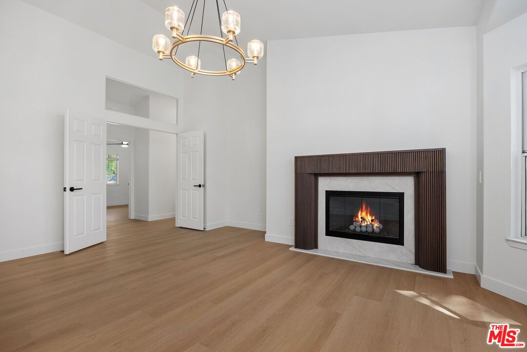 Chandelier, Empty room, Fireplace, Interior, Pendant Lights, Wood Texture Flooring