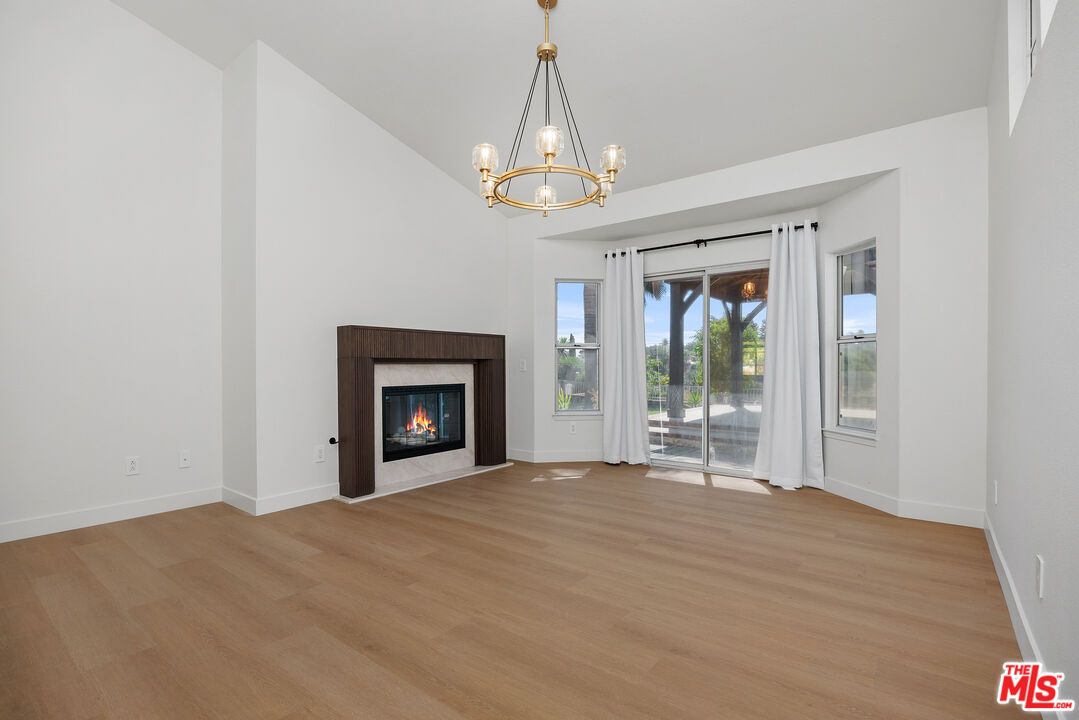 Chandelier, Empty room, Fireplace, Interior, Pendant Lights, Wood Texture Flooring