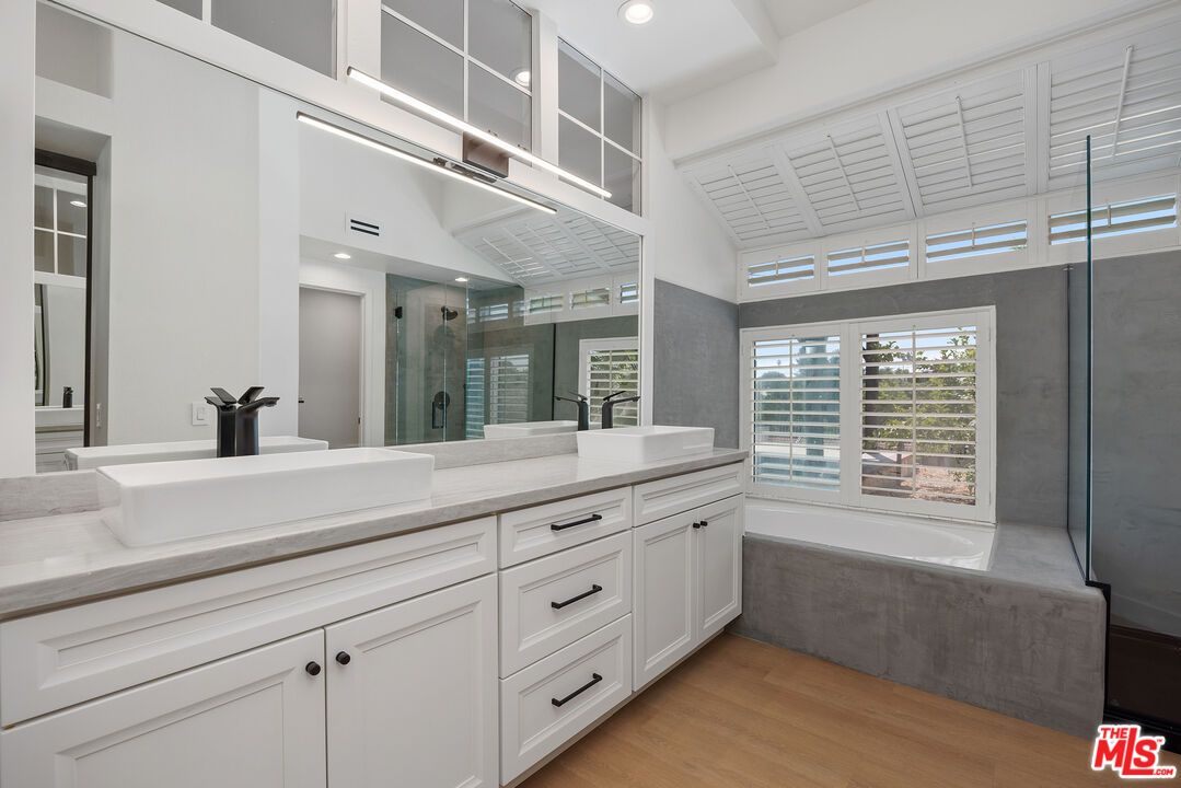Bathroom, Dual Sink Vanities, Glass Shower, Interior, Recessed Lighting, Wood Texture Flooring