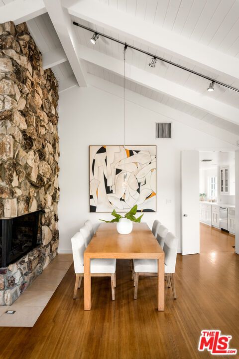 Dining room, Fireplace, Interior, Pendant Lights, Stone Walls, Wood Texture Flooring