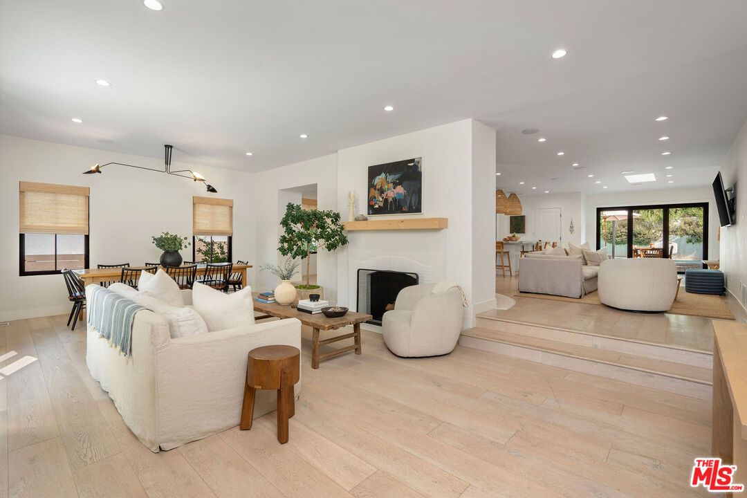 Dining room, Fireplace, Interior, Living room, Pendant Lights, Recessed Lighting, Wood Texture Flooring