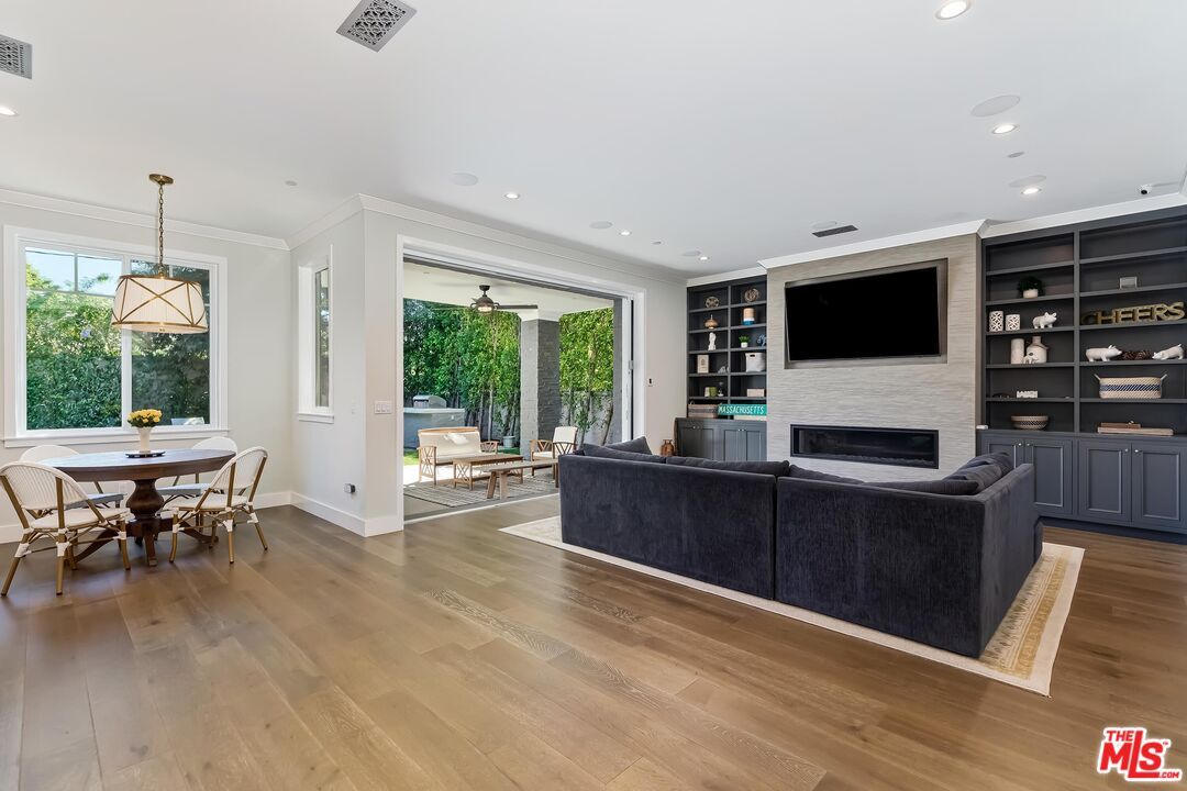 Dining room, Fireplace, Interior, Living room, Pendant Lights, Recessed Lighting, Wood Texture Flooring