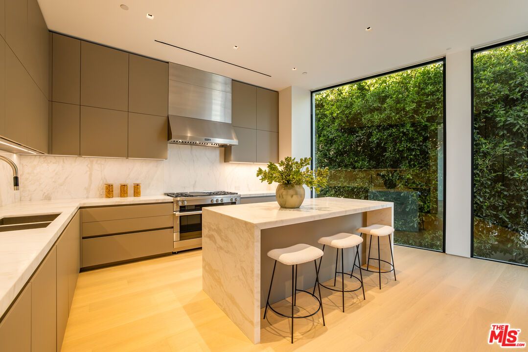 Interior, Kitchen, Marble Walls, Recessed Lighting, Stainless Steel Appliances, Wood Texture Flooring