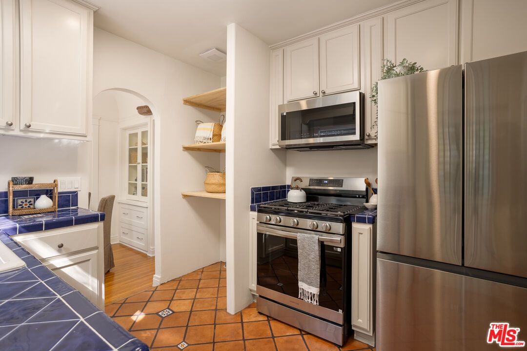 Interior, Kitchen, Stainless Steel Appliances, Tile Countertops, Wood Texture Flooring