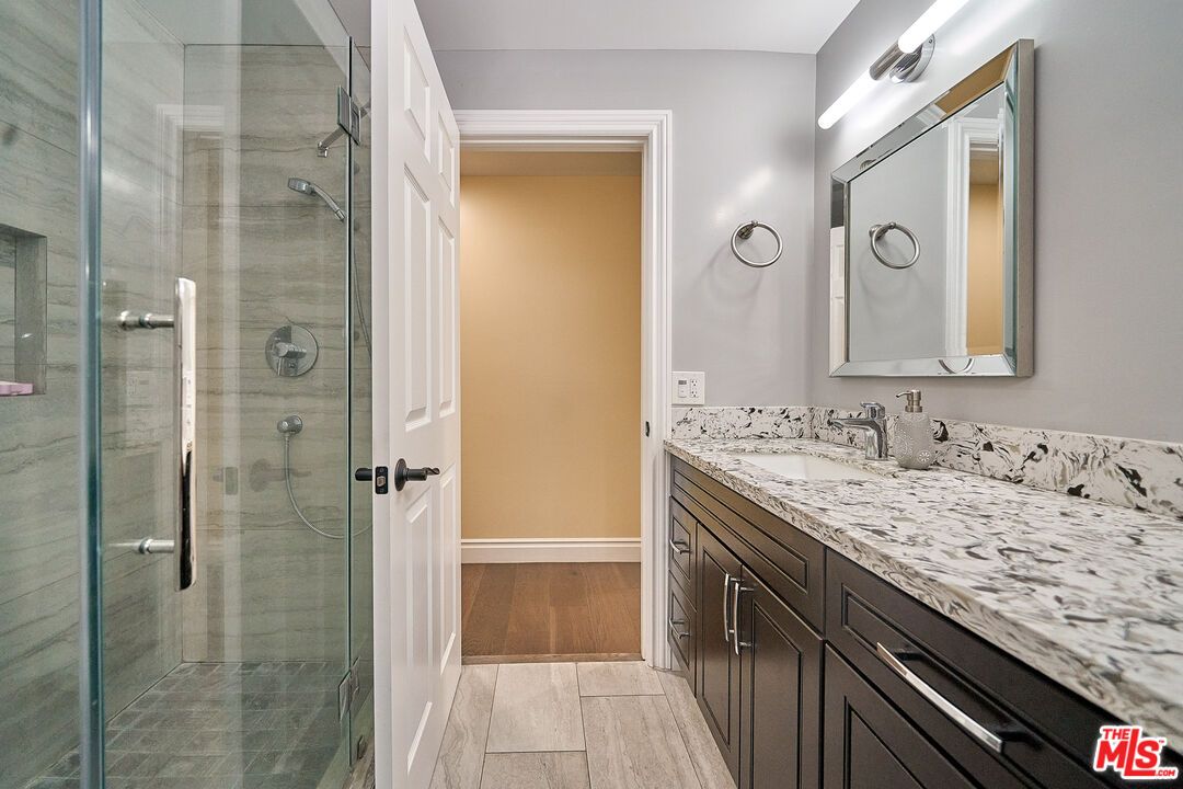 Bathroom, Dual Sink Vanities, Glass Shower, Interior, Wood Texture Flooring
