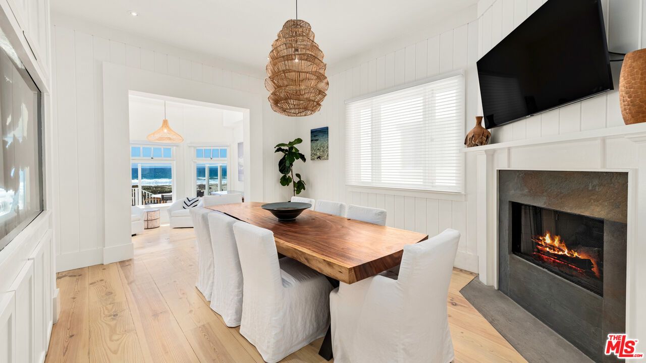 Dining room, Fireplace, Interior, Pendant Lights, Recessed Lighting, Water, Wood Texture Flooring