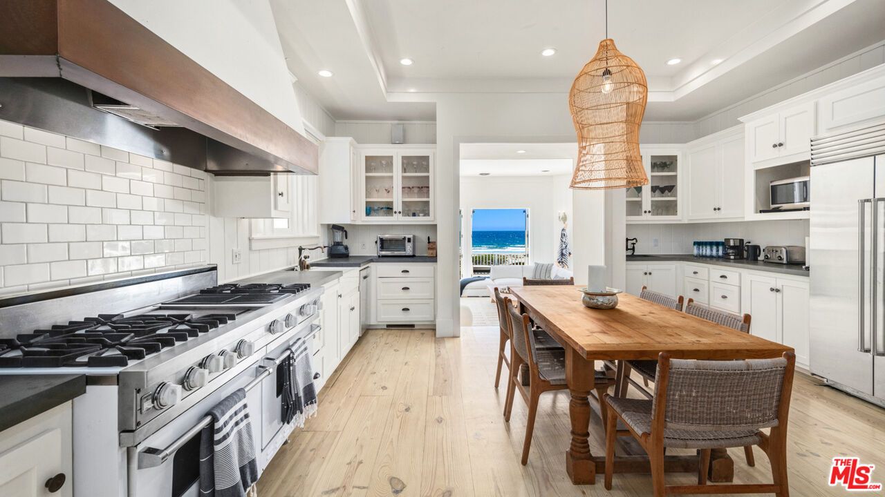 Dining room, Interior, Kitchen, Pendant Lights, Recessed Lighting, Stainless Steel Appliances, Water, Wood Texture Flooring