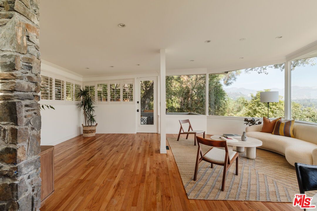 Fireplace, Interior, Living room, Recessed Lighting, Stone Walls, Wood Texture Flooring