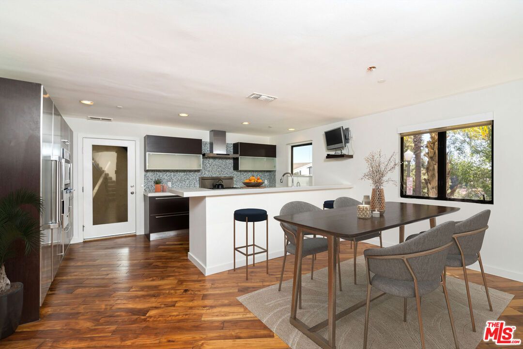 Dining room, Interior, Kitchen, Recessed Lighting, Stainless Steel Appliances, Wood Texture Flooring