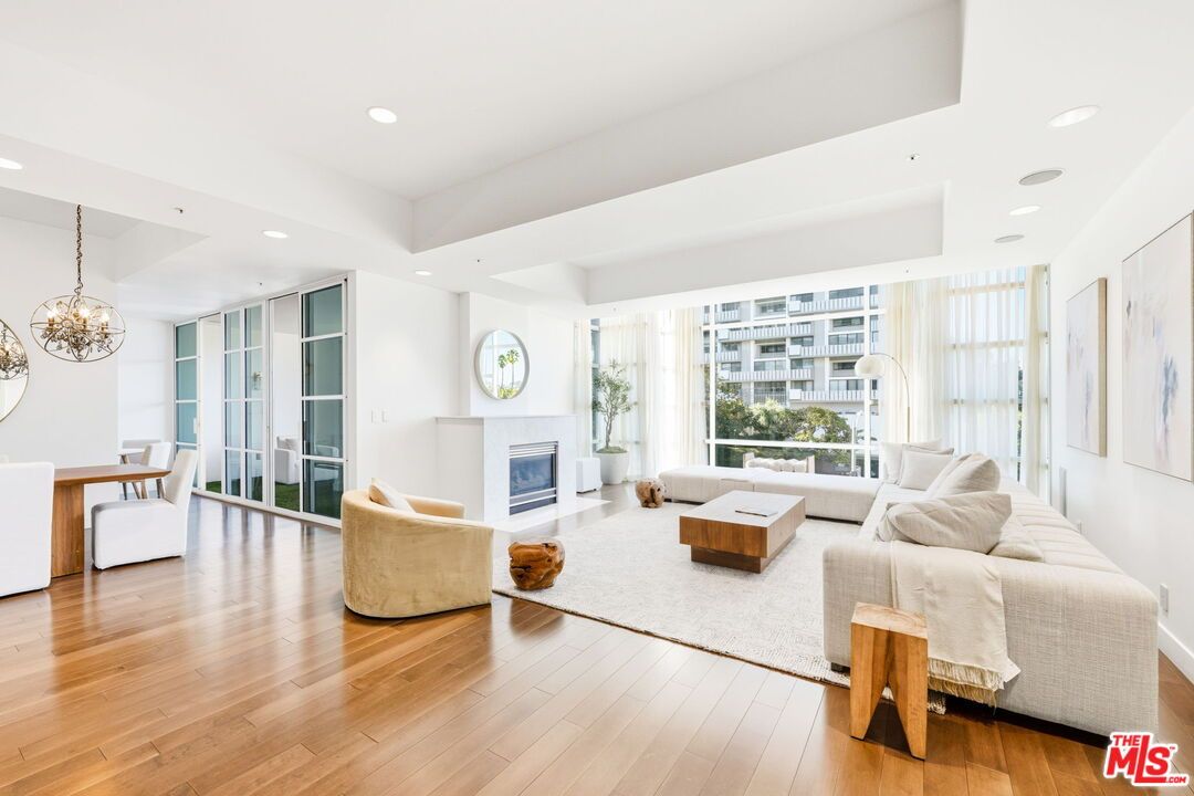 Chandelier, Dining room, Fireplace, Interior, Living room, Pendant Lights, Recessed Lighting, Wood Texture Flooring