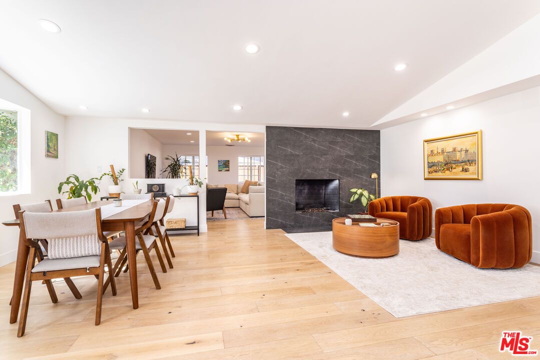 Dining room, Fireplace, Interior, Living room, Recessed Lighting, Wood Texture Flooring