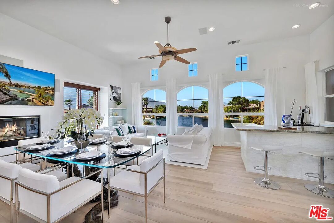 Dining room, Fireplace, Interior, Living room, Recessed Lighting, Water, Wood Texture Flooring
