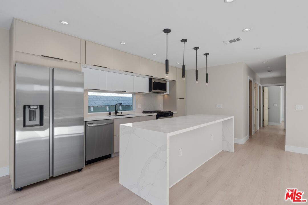 Interior, Kitchen, Pendant Lights, Recessed Lighting, Stainless Steel Appliances, Wood Texture Flooring