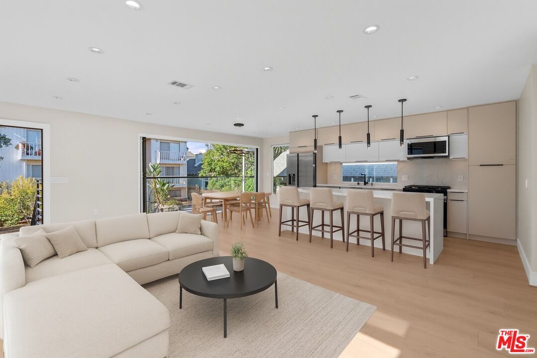 Dining room, Interior, Kitchen, Living room, Pendant Lights, Recessed Lighting, Stainless Steel Appliances, Wood Texture Flooring