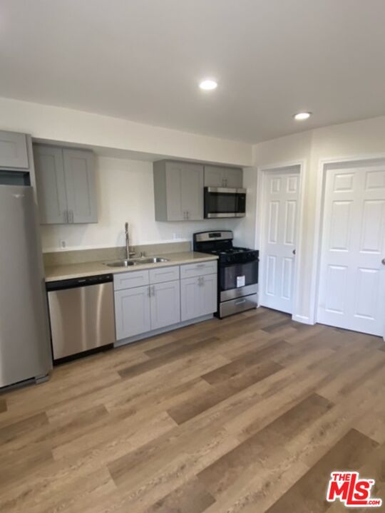 Interior, Kitchen, Recessed Lighting, Stainless Steel Appliances, Wood Texture Flooring