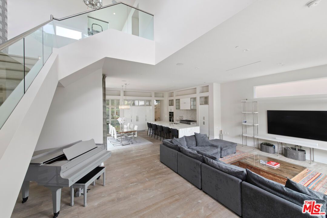 Dining room, Interior, Living room, Pendant Lights, Piano, Recessed Lighting, Wood Texture Flooring