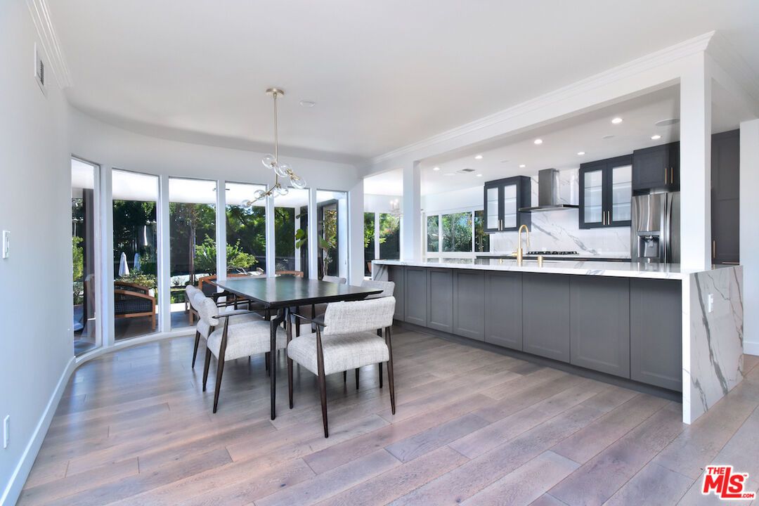 Dining room, Interior, Kitchen, Pendant Lights, Recessed Lighting, Stainless Steel Appliances, Wood Texture Flooring