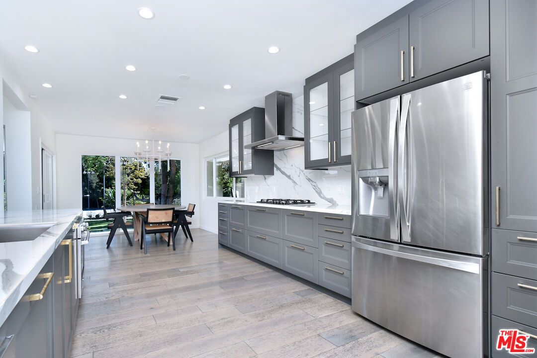 Chandelier, Dining room, Interior, Kitchen, Recessed Lighting, Stainless Steel Appliances, Wood Texture Flooring